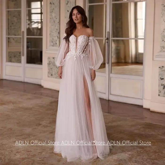 Robe de mariée princesse personnalisée avec manches bouffantes, col en V, perles, appliques en dente