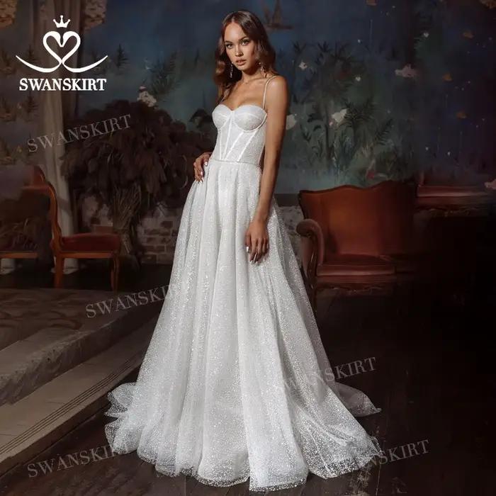 Robe de mariée brillante sans manches 2026