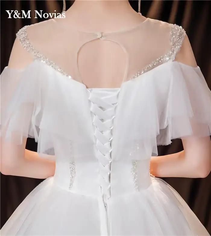 Robe de mariée ivoire à col rond personnalisée