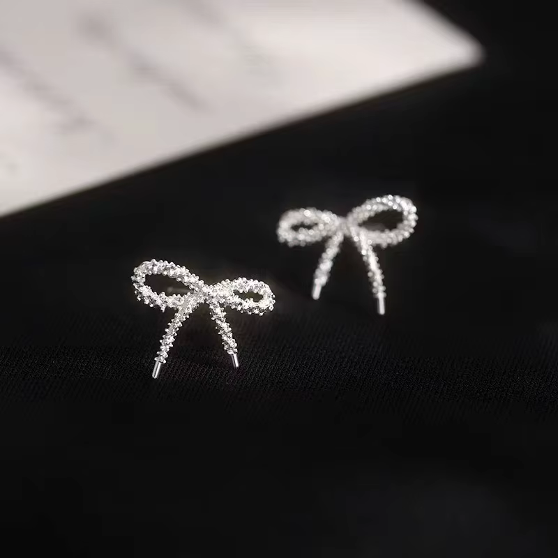 Boucles d'oreilles clous nœud papillon brillantes couleur argent pour femme, bijoux élégants et tend