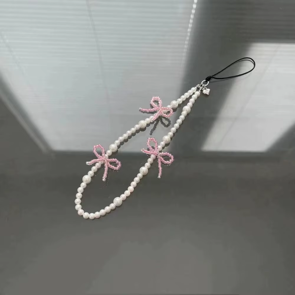 Corée mignon rose nœud papillon perle pendentif perlé téléphone HYun pour iPhone accessoires lanière