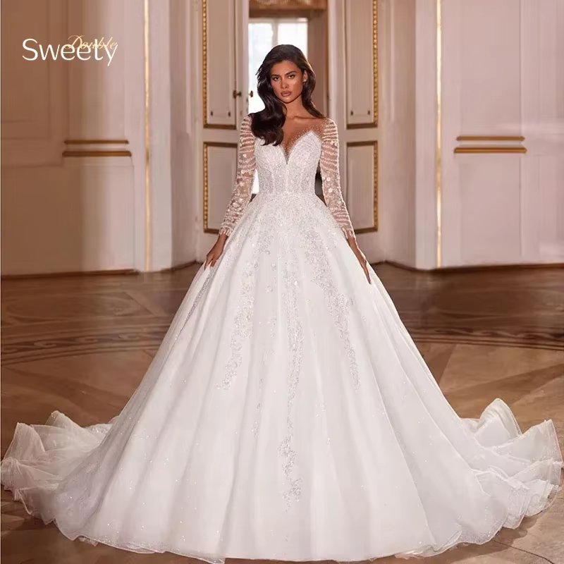 Robe De mariée luxueuse en dentelle brodée sur filet avec paillettes, col rond, manches longues, bou