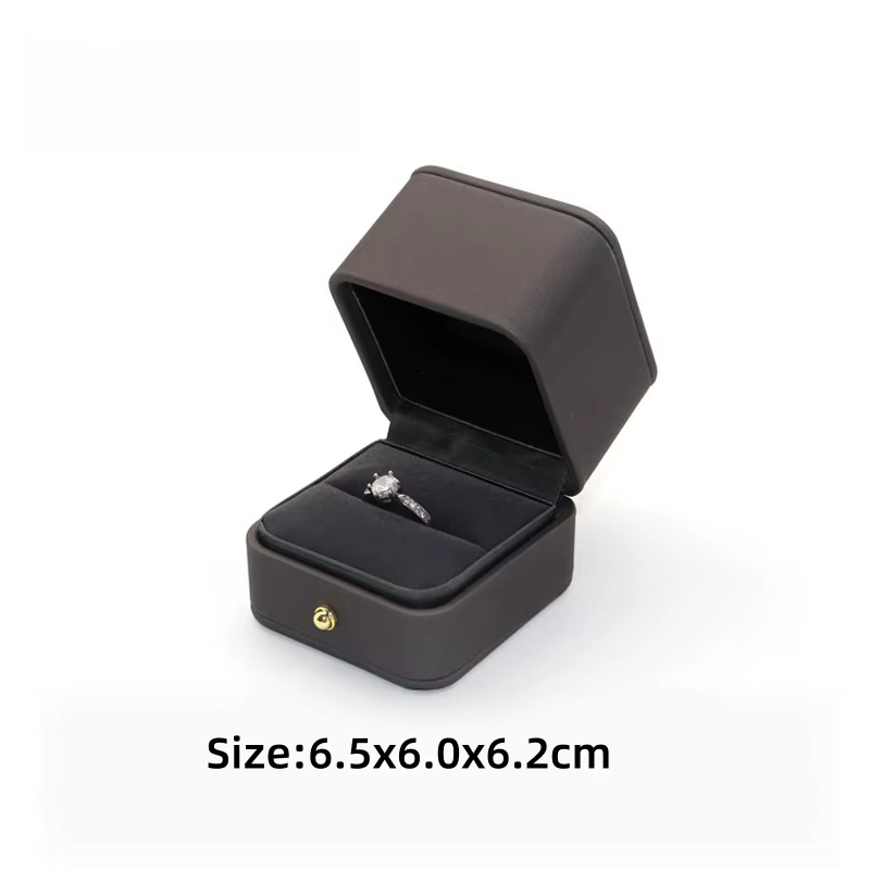 Boîte à bijoux en cuir PU de qualité supérieure avec bouton doré, coins arrondis, pour bagues, boucl