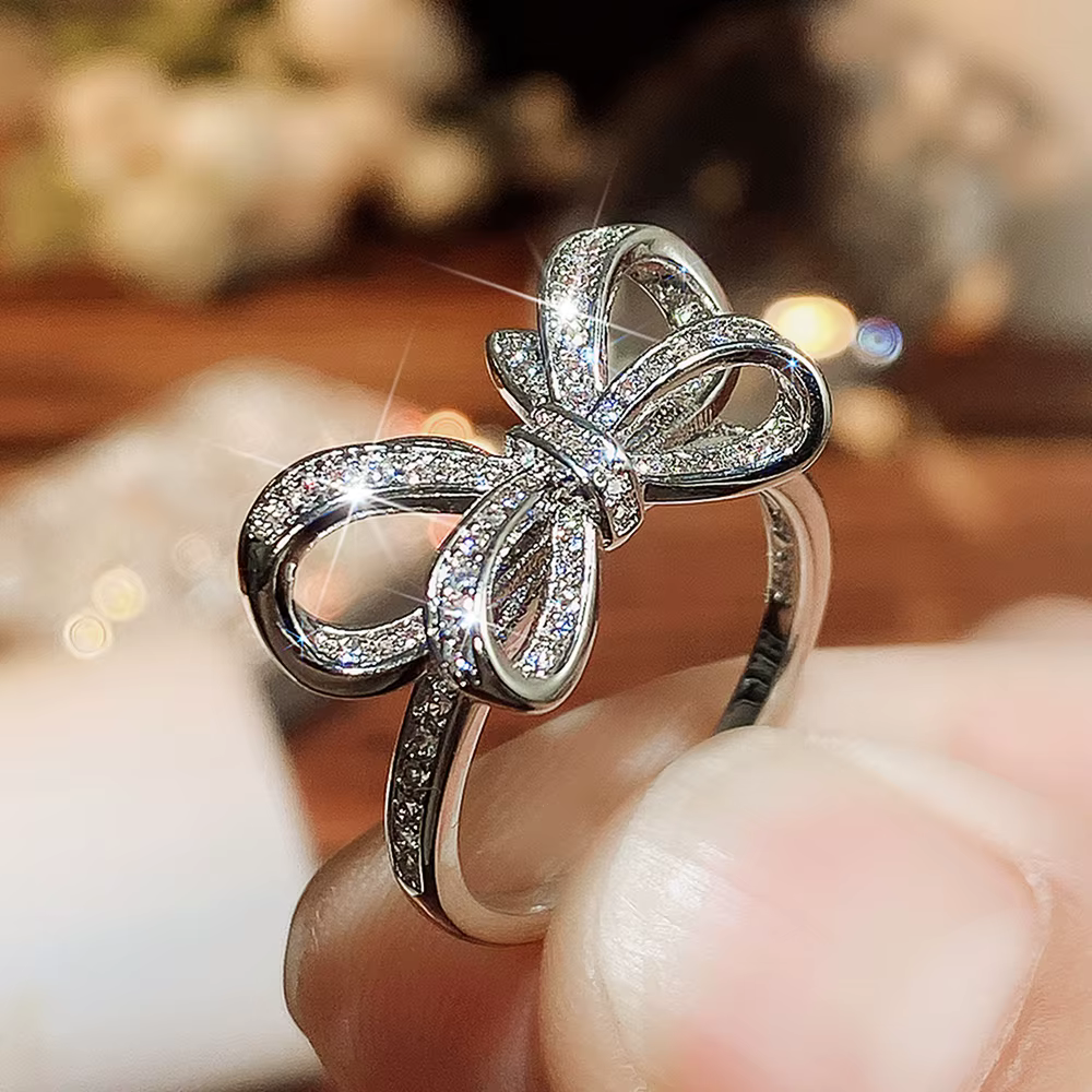 Huitan – bagues à nœud scintillant pour femmes, couleur argent de luxe, accessoires de doigt à la mo
