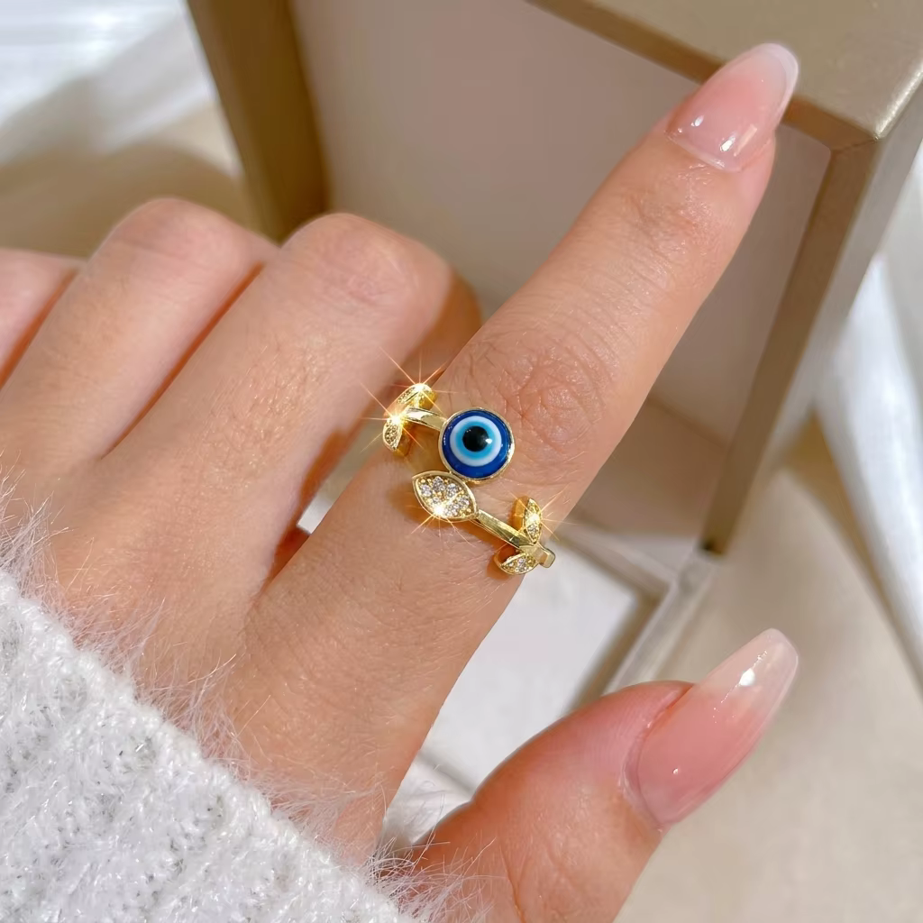 Bague en cuivre sertie de zircon cubique motif feuille et œil bleu pour femme, design ouvert élégant