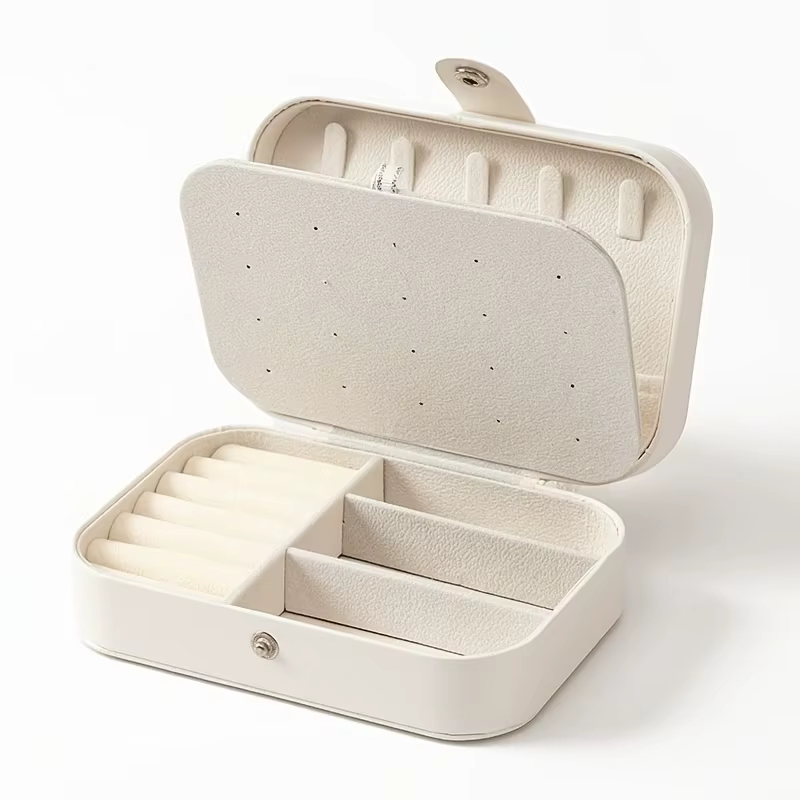 Une boîte à bijoux en flanelle, petite et portable, avec plusieurs compartiments, pouvant contenir d