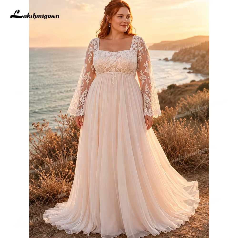 Robe de mariée romantique grande taille en tulle coupe trapèze, avec manches longues transparentes e