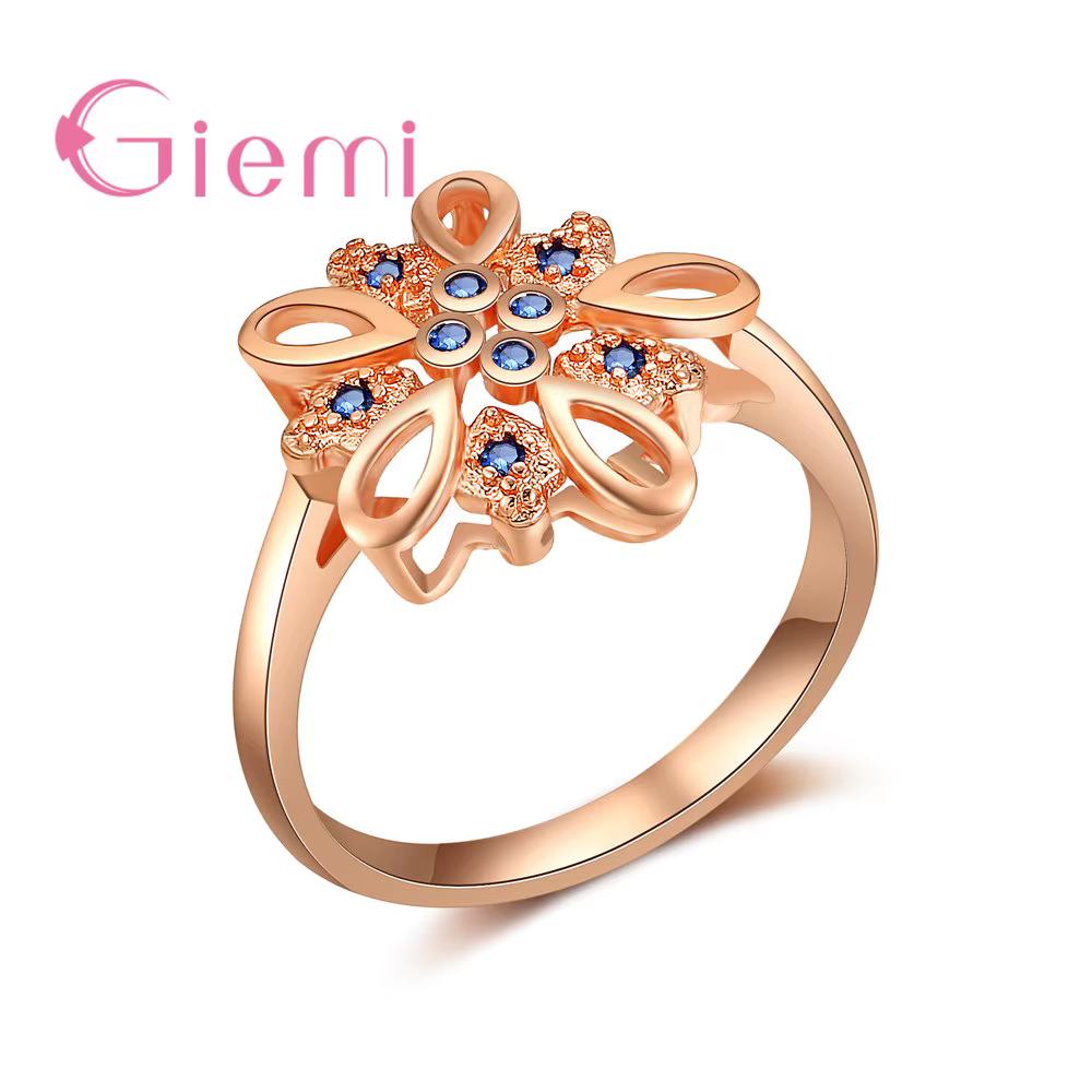 Bague creuse en forme de fleur en or rose pour femme, bijoux incrustés de cristal bleu royal, style 