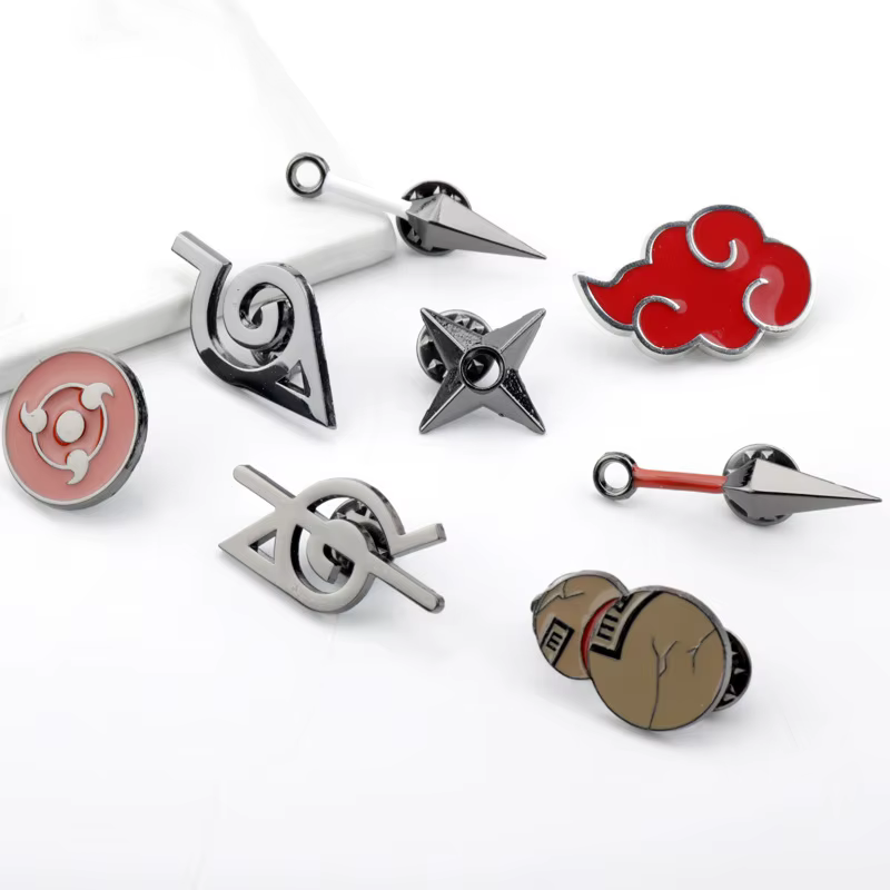 Lot de 8 broches symboles mystérieux Shinobi – Épingles en alliage « Dague Volante » et « Pupille My
