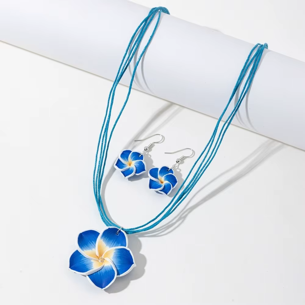 Parure de bijoux en argile souple motif fleur de frangipanier, style bohème, collier et boucles d'or