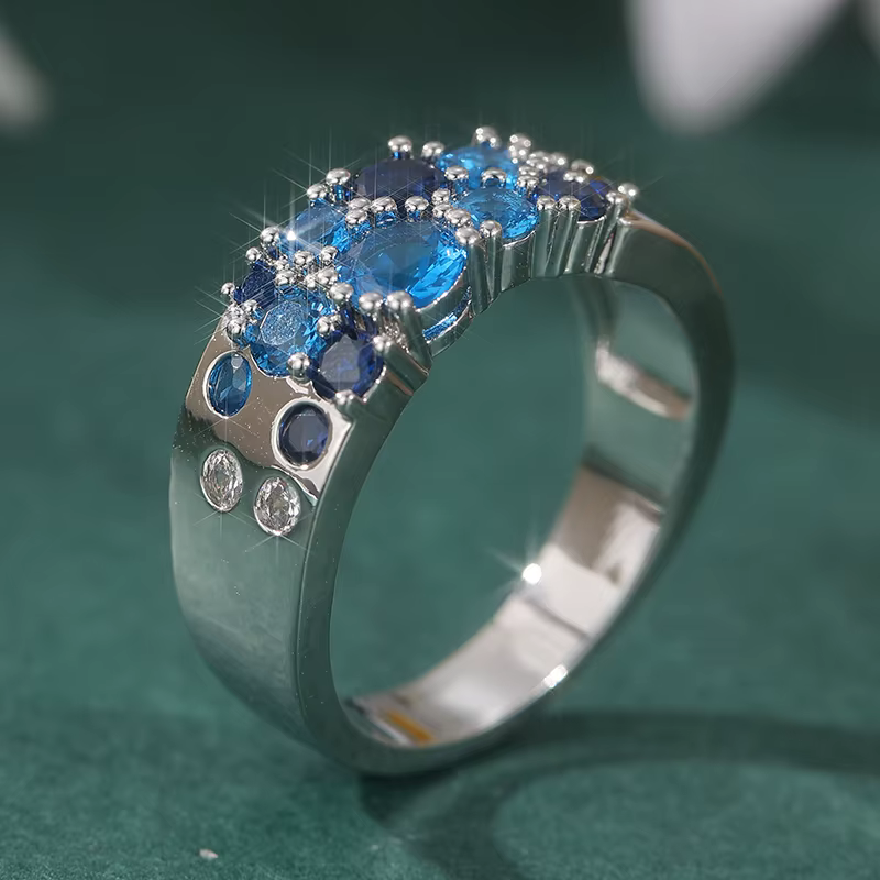 Bague tendance pour femme en argent avec incrustation de zirconiums bleus, motif géométrique, idéale