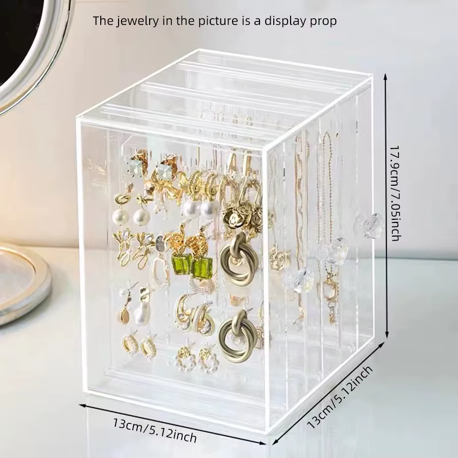 Un vitrine transparente pour boucles d'oreilles et colliers, mallette de rangement en plastique vint