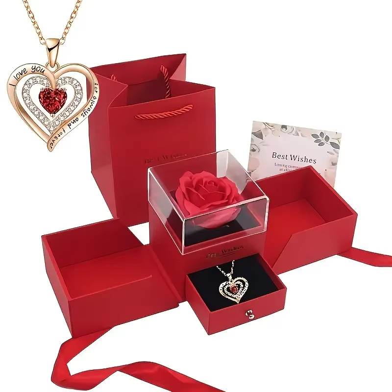 La boîte à bijoux créative en rose éternelle à double porte avec un charmant collier en forme de cœu