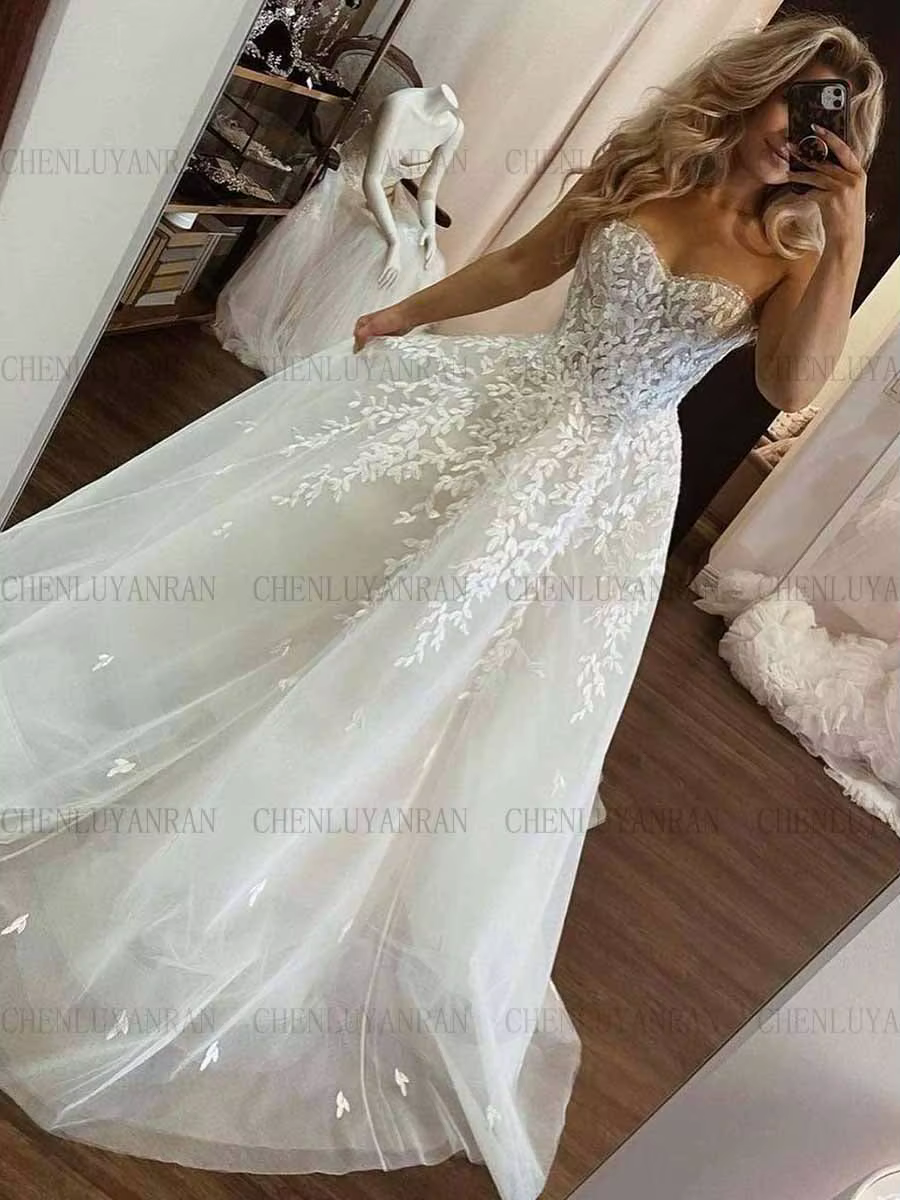 Robes de mariée longues sans bretelles pour femmes, appliques A-ligne, robes élégantes scintillantes