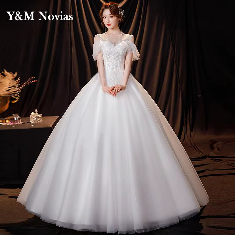 Robe de mariée ivoire à col rond personnalisée