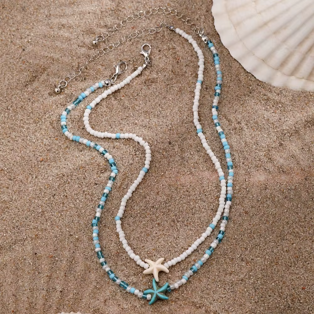 Collier avec pendentif coquillage et étoile de mer