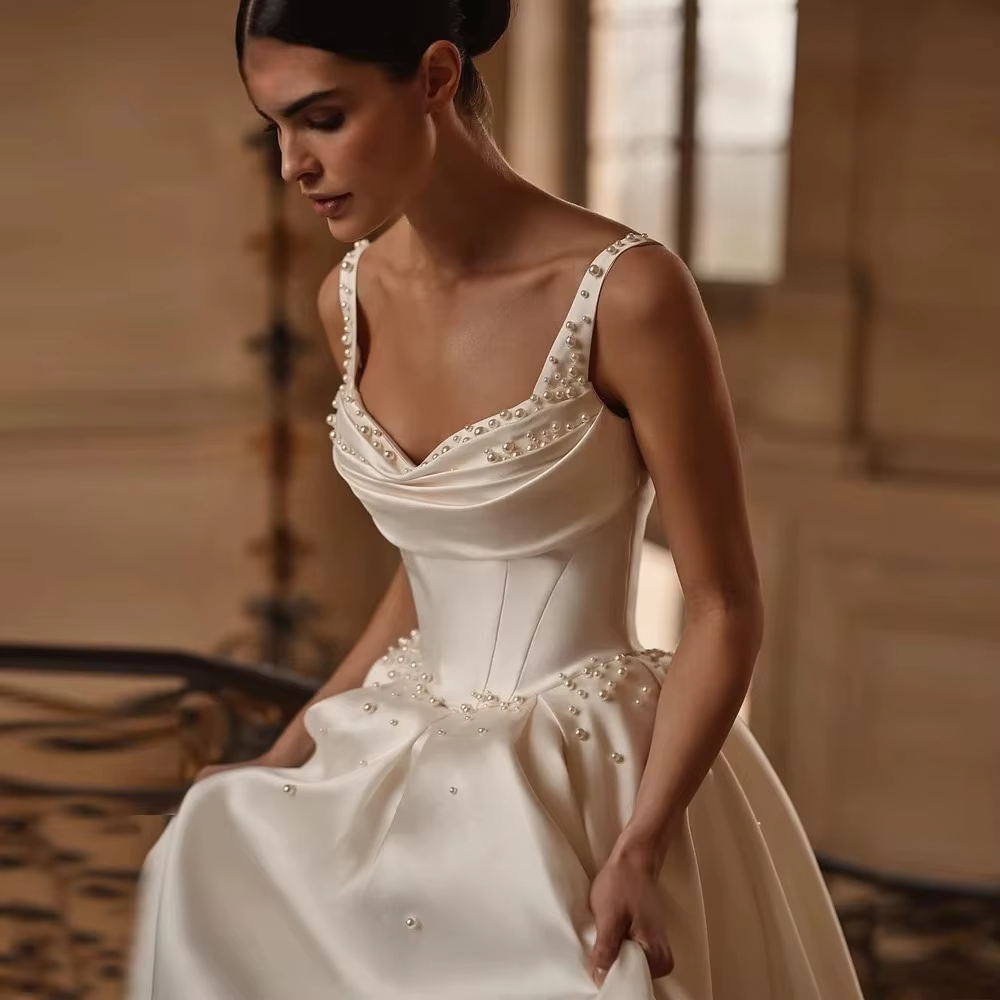 Perles élégantes a-ligne robes de mariée bretelles Spaghetti Satin