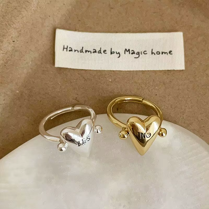 Bague en forme de cœur rotative lisse pour femmes et hommes