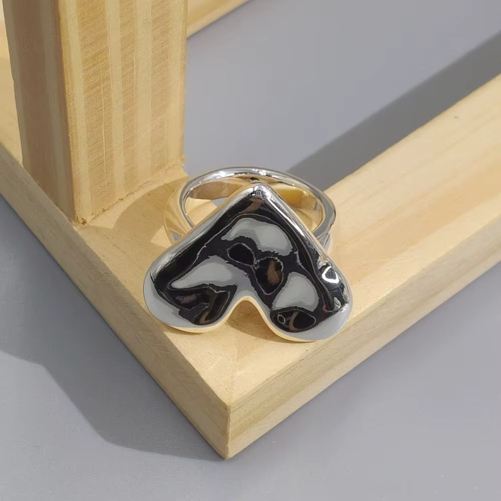 Bague en forme de cœur or et argent