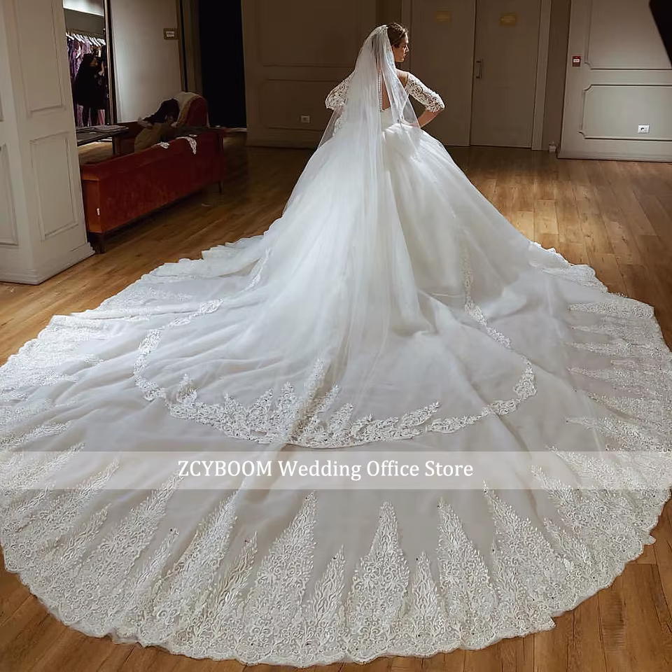 Robe de mariée princesse à manches longues 2026