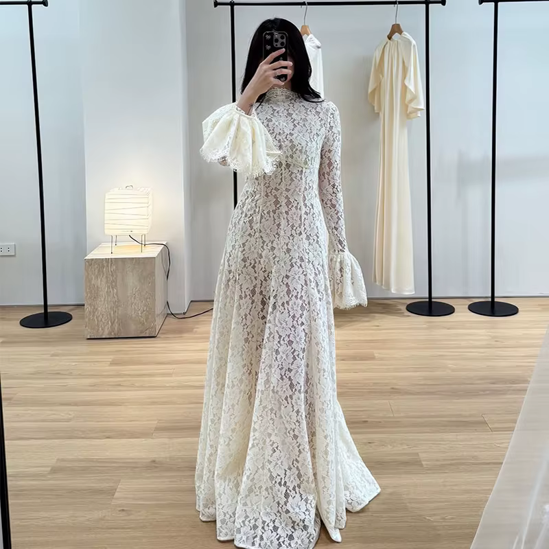 Robe de soirée élégante blanche à manches longues en dentelle transparente