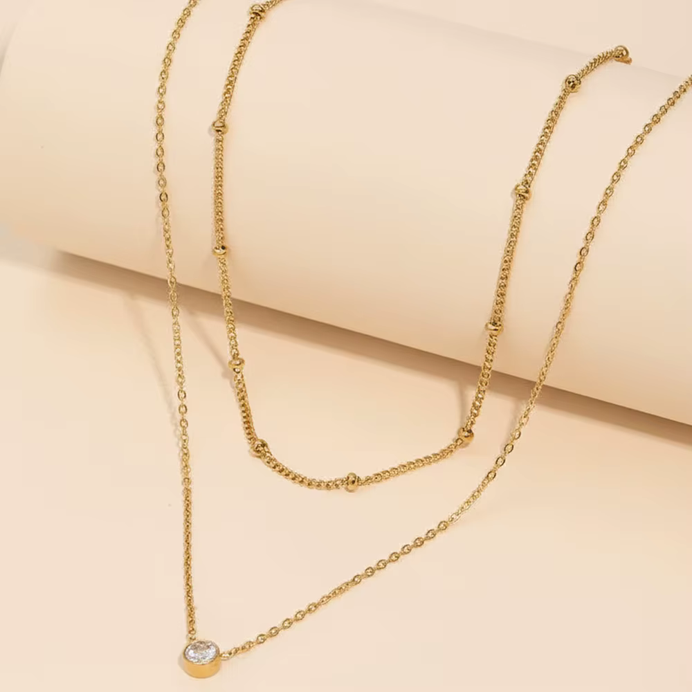 Colliers superposés dorés pour femmes
