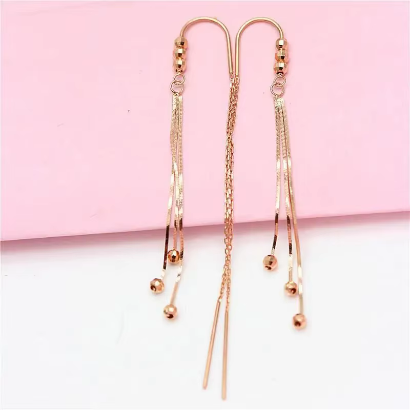 Boucles d'oreilles pompon longue chaîne souple pour femme