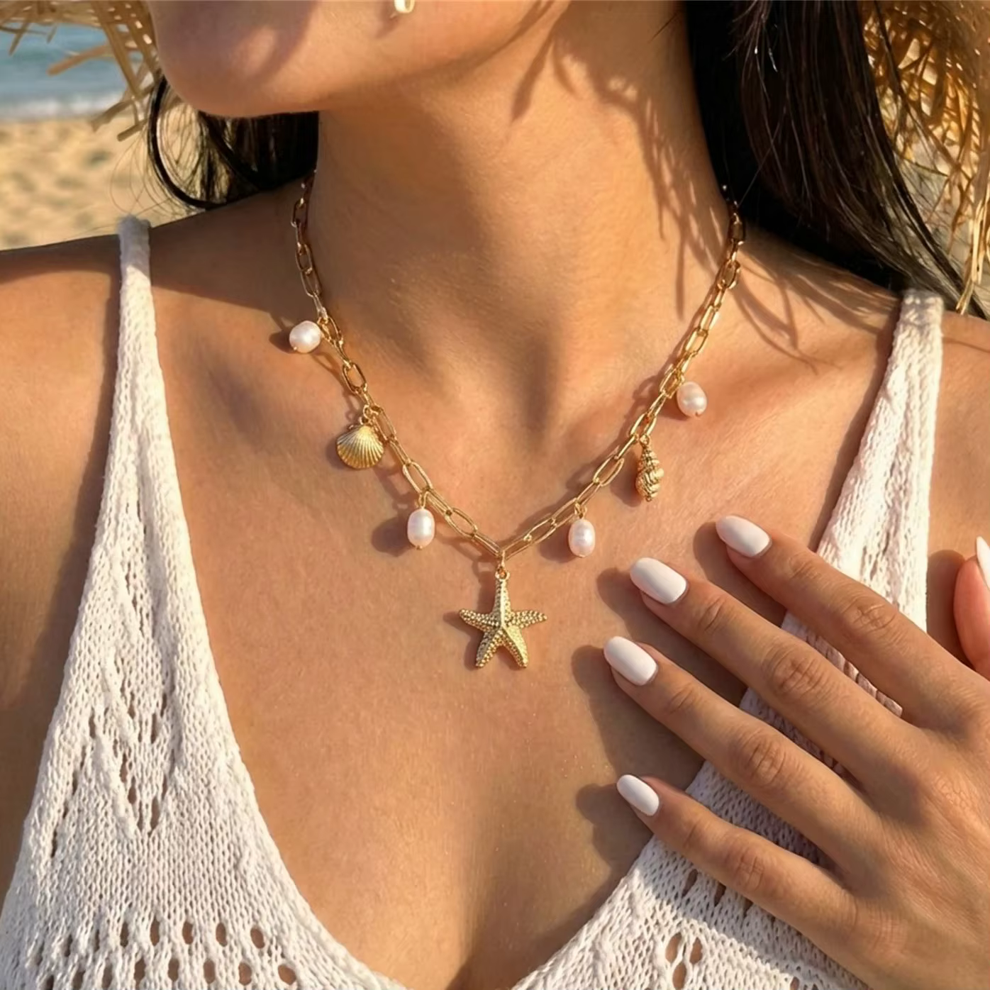Collier pendentif bohème en métal étoile de mer et conque pour femme