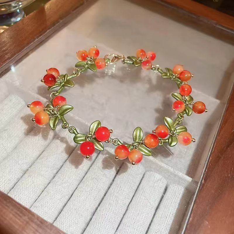 Bracelet à breloques perlé orange pour femme