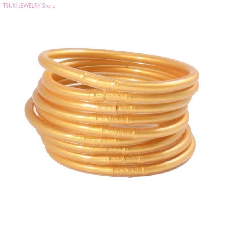 62KE – Bracelet gelée en plastique rempli feuille d'or clair
